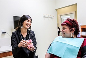 Smiling woman looking at watch